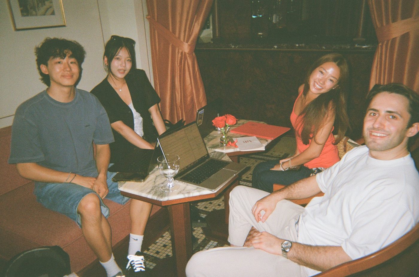 Friends round a table, on film