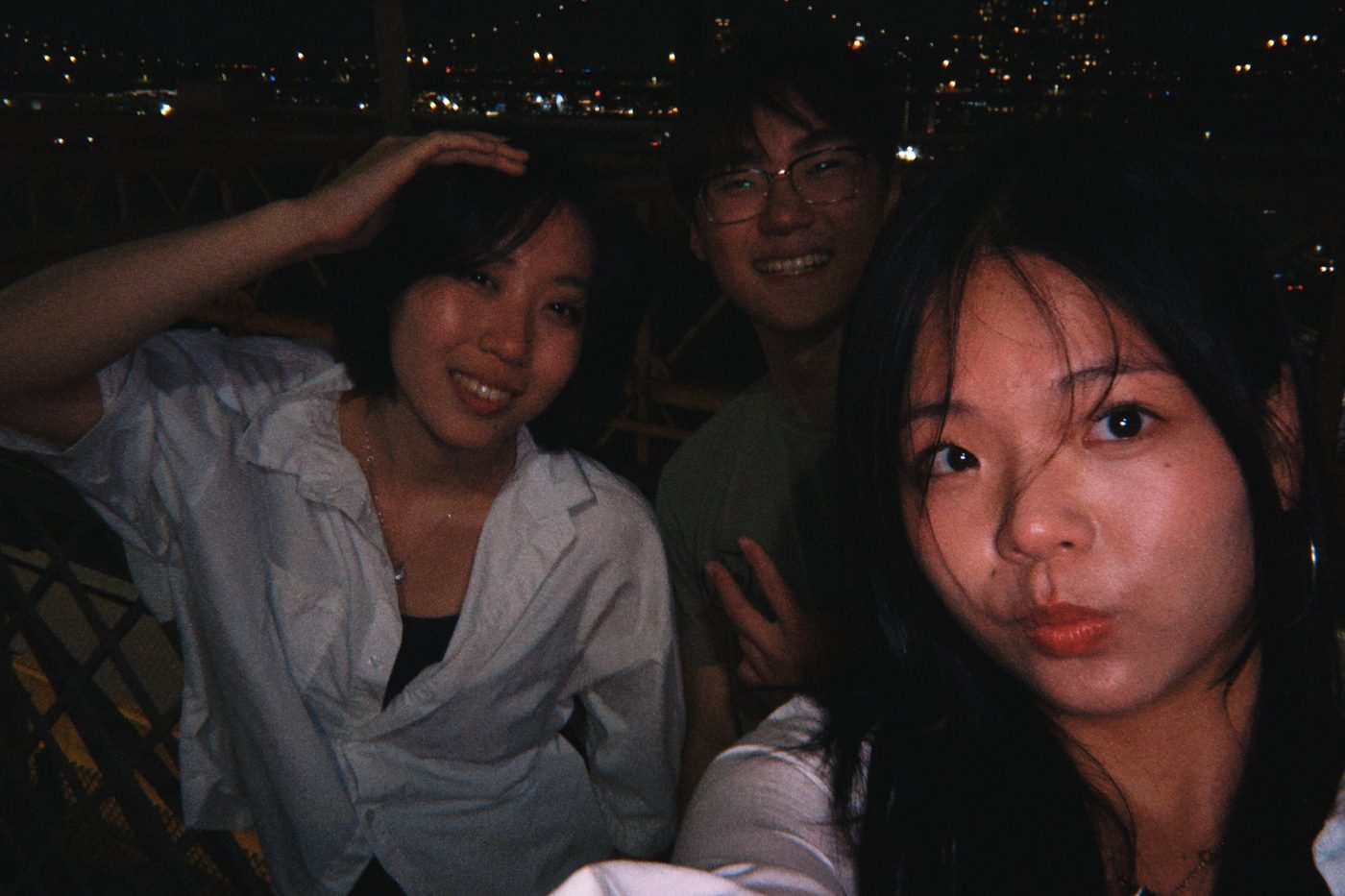 A night-time selfie with friends, on film